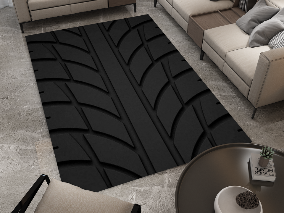 A modern living room featuring a bold, black rug designed to resemble a tire tread pattern. The room has a contemporary and stylish atmosphere, with the tire rug adding a unique automotive touch.